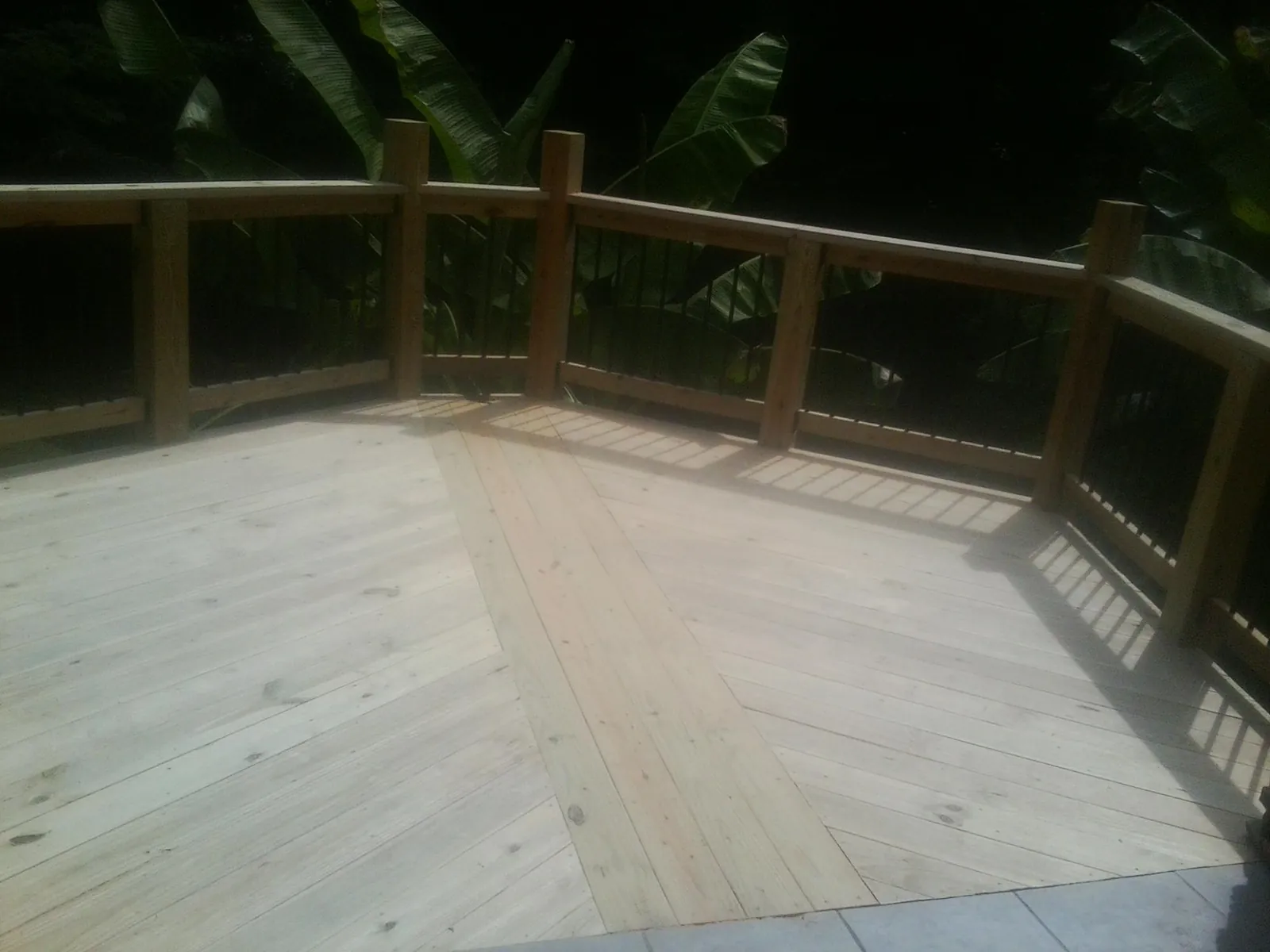 New wood deck and railing built off the back of a home in Mesquite
